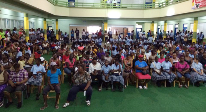 West St. George Secondary School students and their parents wait to collect laptops on Tuesday. (Photo: Camillo Gonsalves/Facebook)